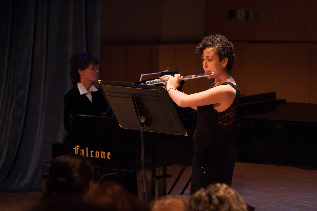 Performer, Emily Patricia Harrington, plays "Concertino, Op. 107" on the flute. Harrington's family were on hand before the Honors Recital on Dec. 3 to show their support. "It's not possible without their parents' support," said her aunt about the students' success. The family also attributed Harrington's success to years of dedication, "[And] Ms. Weller," added Harrington's mother, "she's a very good teacher." Claudia Rodriguez/The Telescope