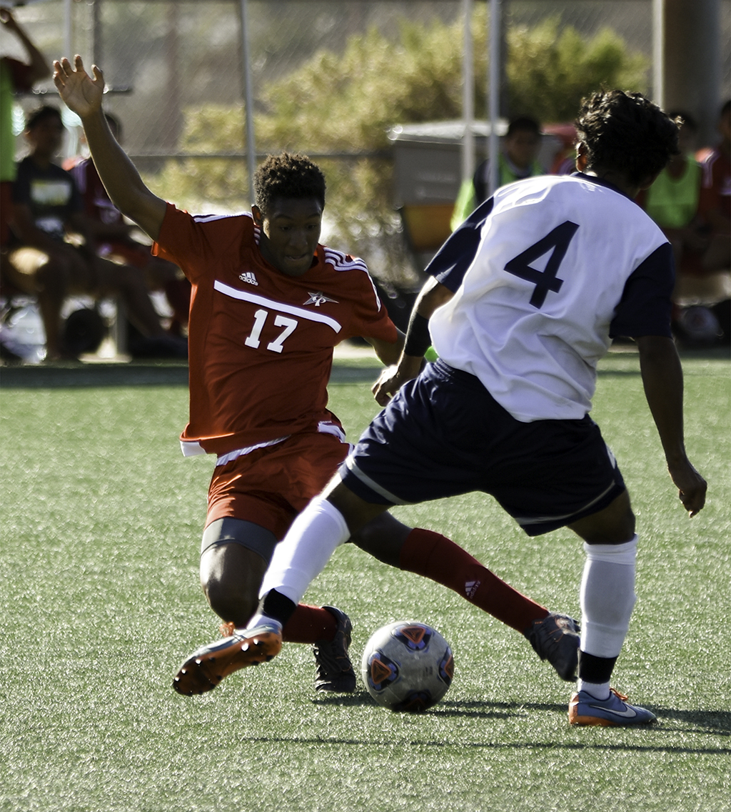 Palomar defender Ty Sample (#17) dives in to win the ball back from Cypress College defender Peter Carranza (#4) in a 2-1 loss at Minkoff Field on Sept. 6. Eric Szaras/The Telescope
