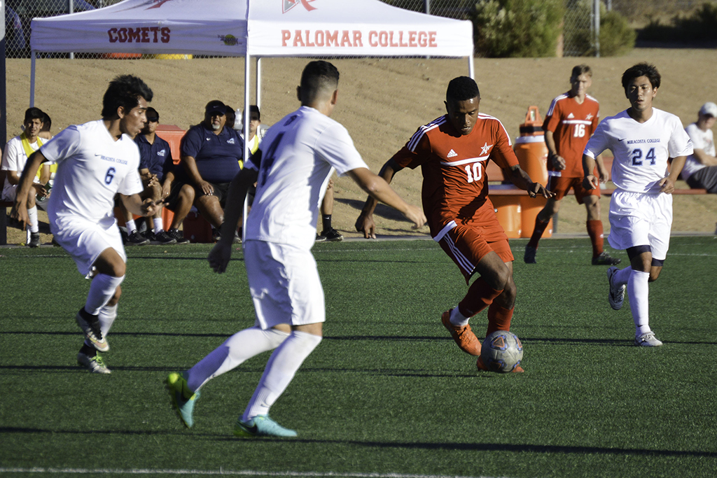Palomar forward Josh Clay (10) dribbles the ball surrounded by MiraCosta defenders. Palomar was defeated 0-4 by MiraCosta Nov. 11 on Minkoff Field. The Comets finished the 2016 season (5-11-5). Dylan Halstead/The Telescope