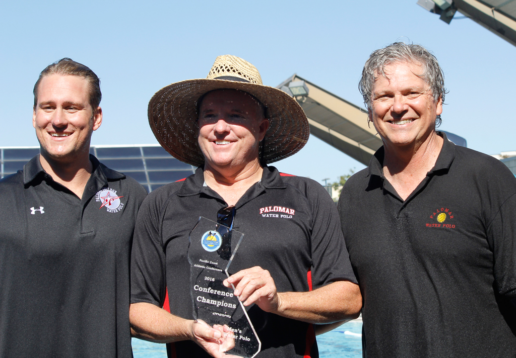 Palomar coaches hold their winning trophy after their team won the 2016 Men's Water Polo PCAC Conference Game between Palomar and Grossmont on Nov. 5 at the Ned Baumer Pool. Palomar men won the title with a score of 10-9. Coleen Burnham/The Telescope