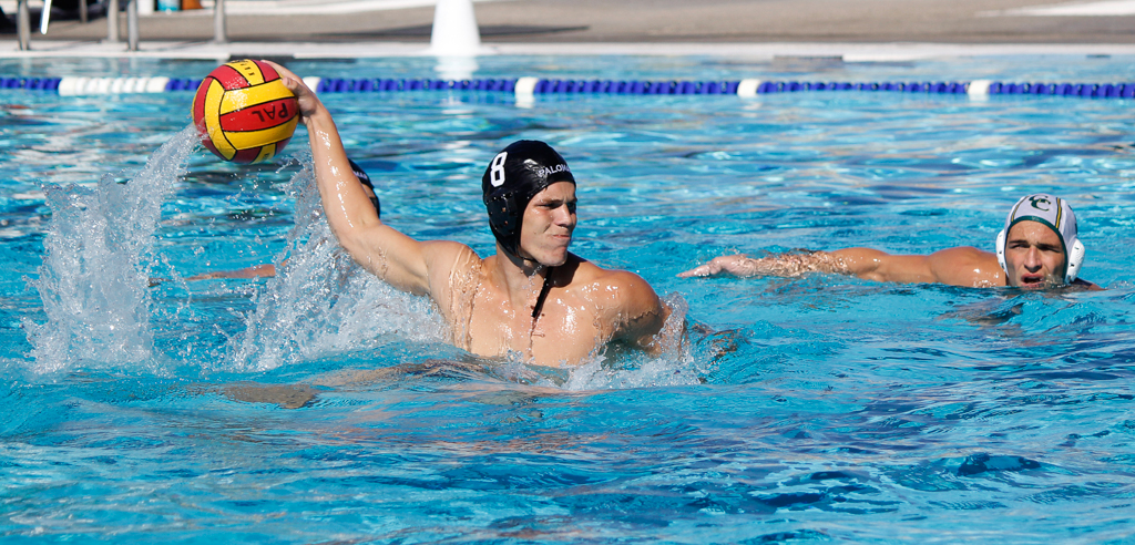 Palomar's Grant Curry (8) shoots goal 2 for the Comets during the Men's Water Polo PCAC Conference Championship Game between Palomar and Grossmont on Nov. 5 at the Ned Baumer Pool. Grossmont's Nick Sedberry (5) is a little late to defend. Curry tallied 1 goal and Palomar won the title with a score of 10-9. Coleen Burnham/The Telescope