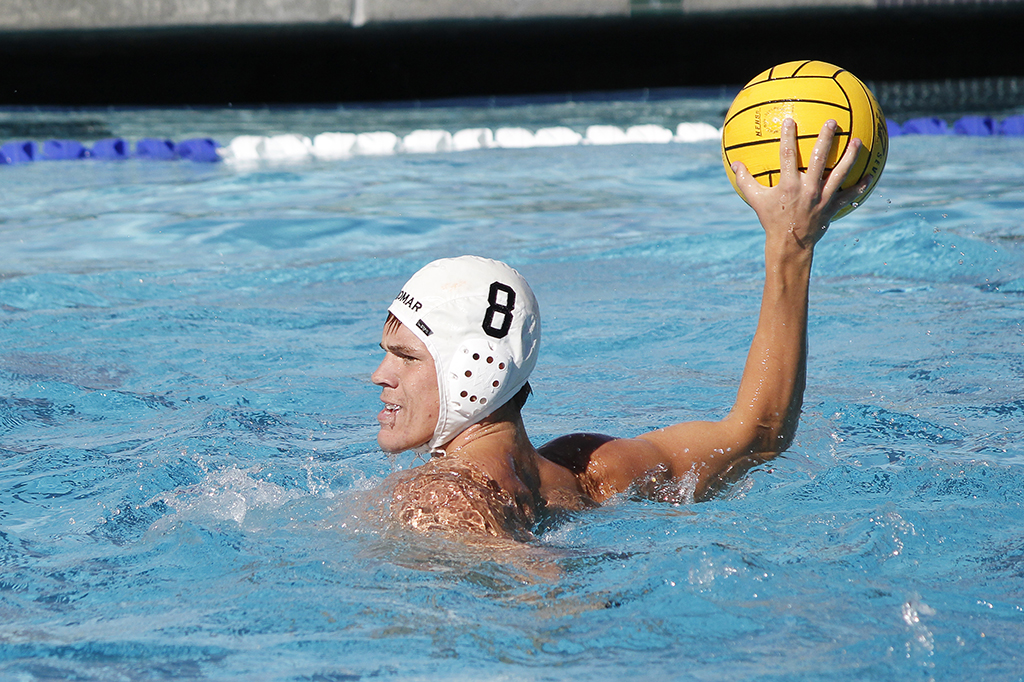 Palomar's Grant Curry (8) gets ready to pass the ball during the Men's Water Polo game between Palomar and Grossmont on Oct. 26 at the Kroc Center. Coleen Burnham/The Telescope