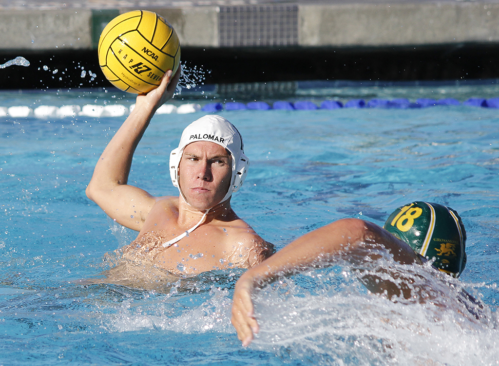 Palomar's Toby Fast (15) gets ready to pass the ball over Grossmont's Chase Lirley (18) during the Men's Water Polo game between Palomar and Grossmont on Oct. 26 at the Kroc Center. Coleen Burnham/The Telescope