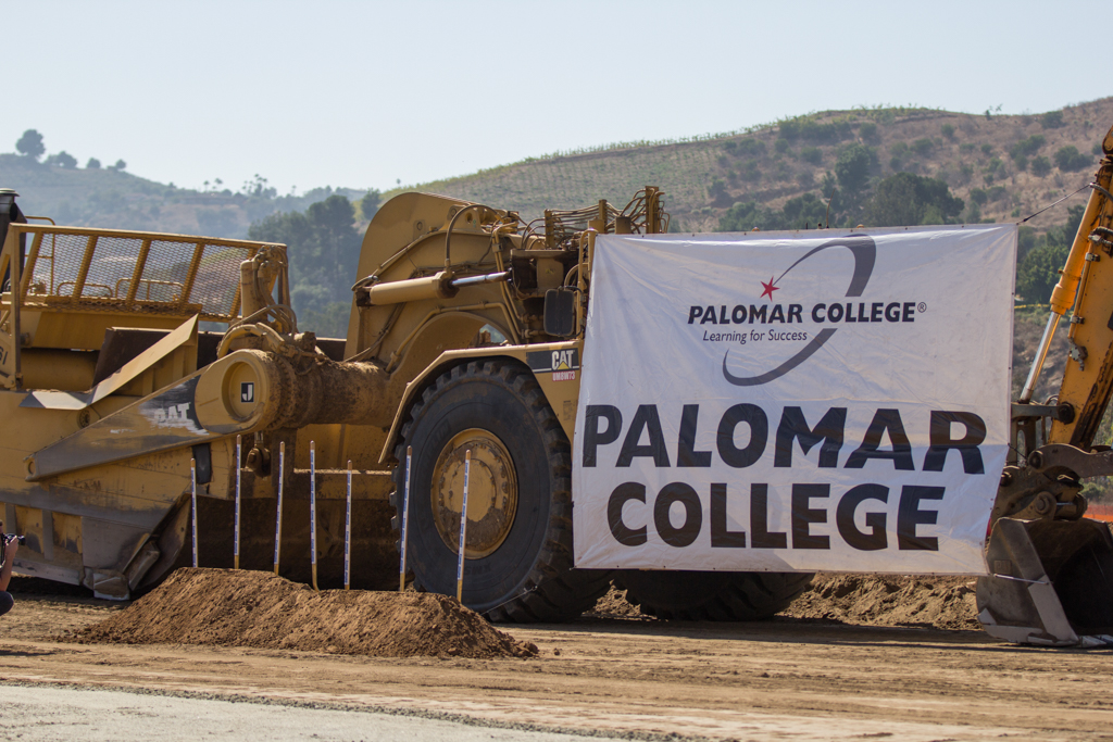 Ceremonial groundbreaking shovels in front of the Palomar College banner and tractors on Oct. 13 to celebrate the Palomar North Education Center. Alexis Metz-Szedlacsek (@skepticully) / The Telescope