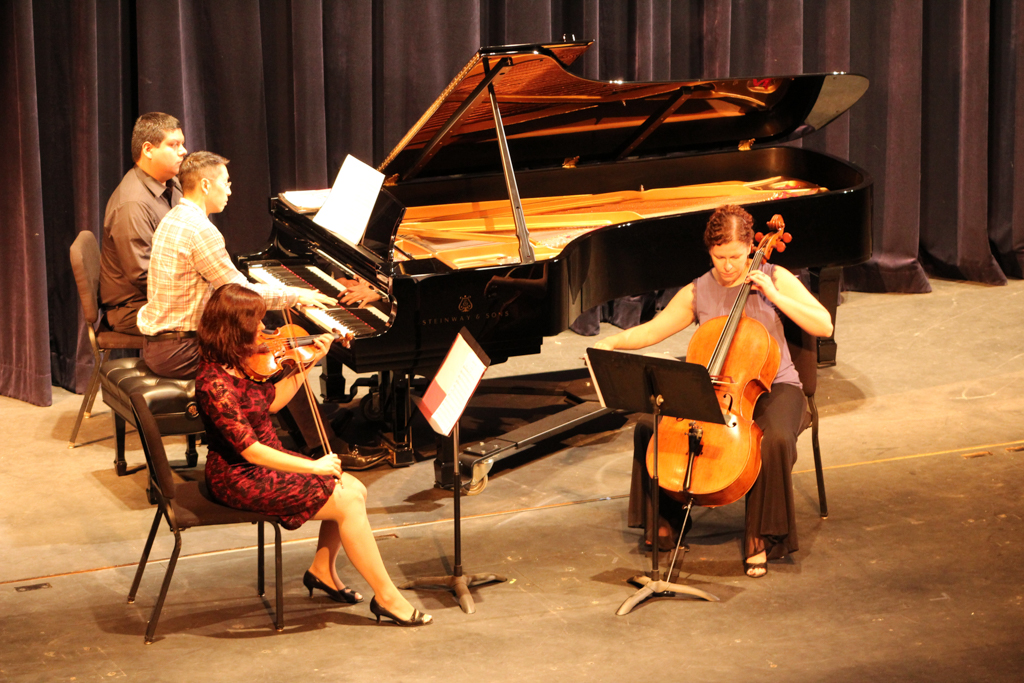Balboa Trio Victoria Bietz (violinst), Byron Chow (pianist), and Erica Erenyi (cellist) perform at Howard Brubeck Theatre during concert hour for Palomar Students. Allen Burton/ The Telescope