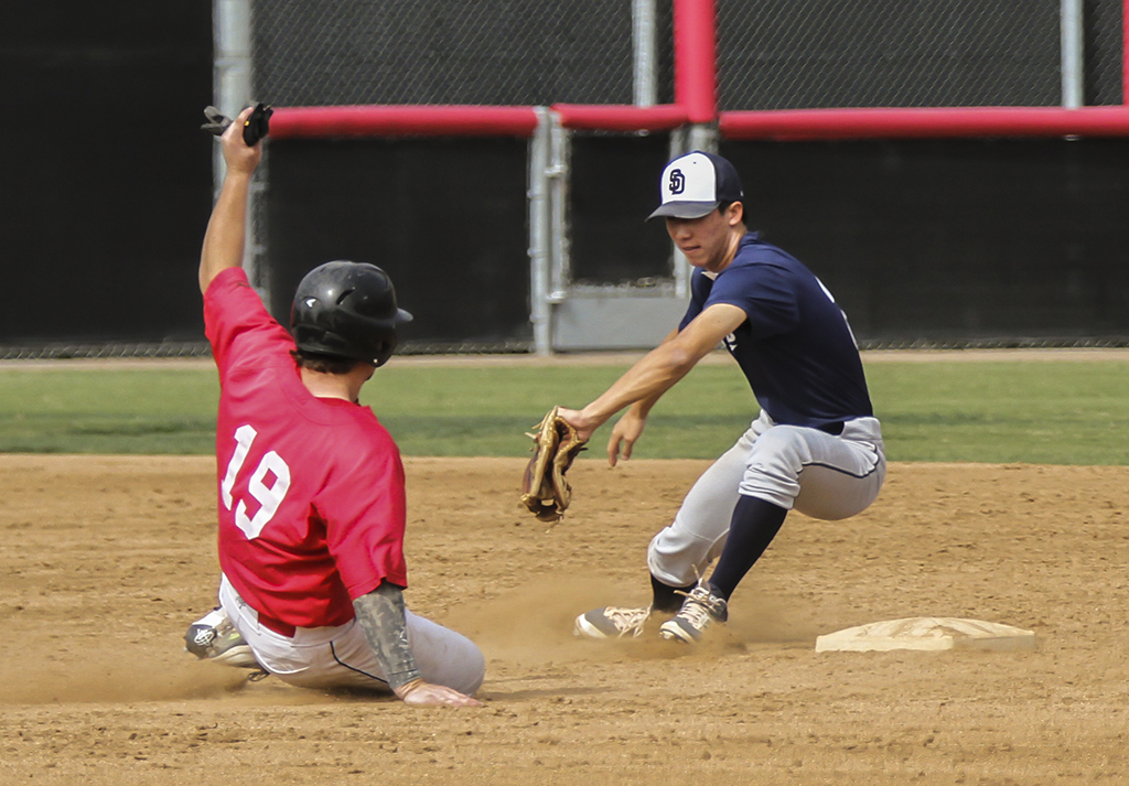 Palomar's Ryan Rivas (19) steals second base and avoids the tag of from the San Diego Padres Scout team second baseman during the 6th inning. The Comets hosted the Padres Scout team on Oct 29 at the ballpark on campus. Philip Farry / The Telescope