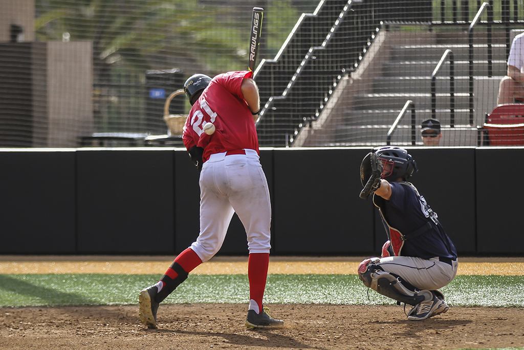 Palomar catcher Tristin King is hit by a pitch in the bottom of the second inning against the visiting San Diego Padres Scout team Oct. 29. Philip Farry / The Telescope