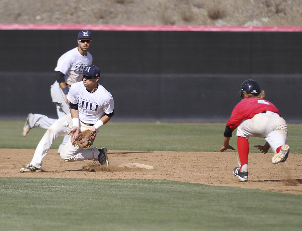 Palomar’s David Hudleson steals second base during the 2nd inning against visiting Hope International University on Nov 04 . Philip Farry / The Telescope