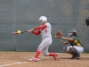 Palomar short-stop Brooke Huddleson (4) singles to left field in the bottom of the 5th inning against Grossmont College on April 8. The Comets won 11-3 over the Griffins. Tracy Grassel/The Telescope.