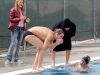 Palomar's Nick Hendricks, Andrew Bertotti ( l to r) and Morgan Brown's mom (far left) cheer on Hayden McCauley as he swims the 200 yard Butterfly during the swim meet against Grossmont at the Wallace Memorial Pool on April 8. McCauley placed first with a time of 2.16.10. Coleen Burnham/The Telescope