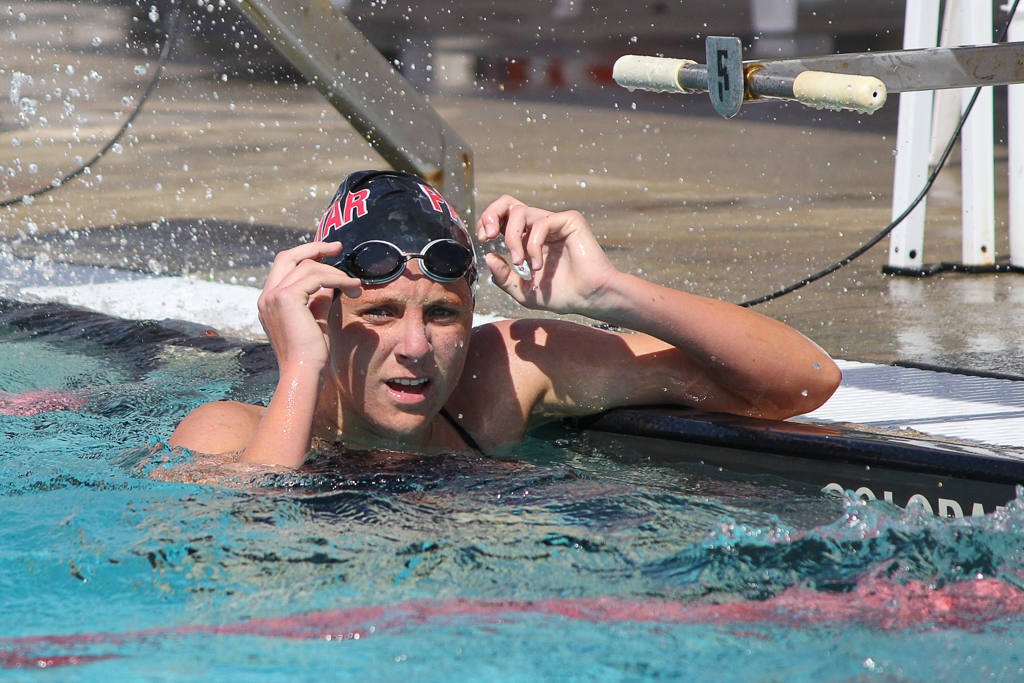 Palomar's Jordan Heimback checks her time after swimming the women’s 200-yard butterfly at the swim meet between Palomar and Grossmont on March 17 at the Wallace Memorial Pool. Heimback placed first with a time of 2:18.33 and the women won the meet overall with a score of 153 - 74. Coleen Burnham/ The Telescope