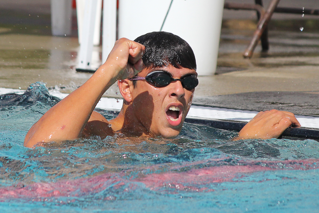 Palomar's Alexander Nider celebrates his win in the men’s 100-yard Freestyle at the swim meet between Palomar and Grossmont on March 17 at the Wallace Memorial Pool. Nider tied for first place with Nicco Birdsong with a time of 51.80. The men lost the meet overall with a score of 136.5 - 103.5. Coleen Burnham/ The Telescope