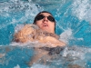 Conner Baine swims the men’s 200-yard backstroke at the swim meet between Palomar and Grossmont on March 17 at the Wallace Memorial Pool. Baines placed first with a time of 2:11.37 but the men lost the meet overall with a score of 136.5 - 103.5. Coleen Burnham/ The Telescope