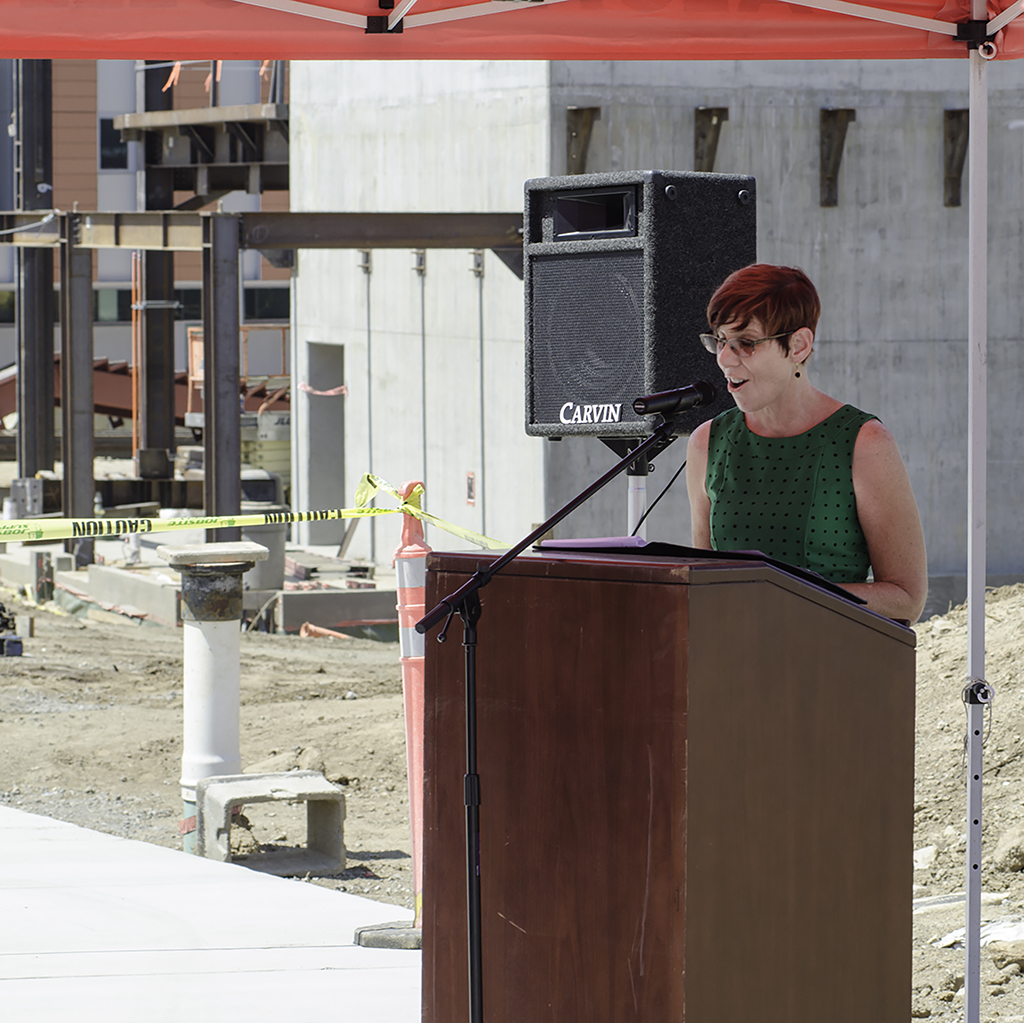 Palomar College Library Manager Connie Steerling gives a speech during the Topping Out Ceremony held at the San Marcos campus on July 28. The Ceremony was commemorating the construction of Palomar's new Library/Learning Resource Center by hoisiting up the last beam and bolting it into place. The new expected completion date is June of 2018. Tracy Grassel/The Telescope