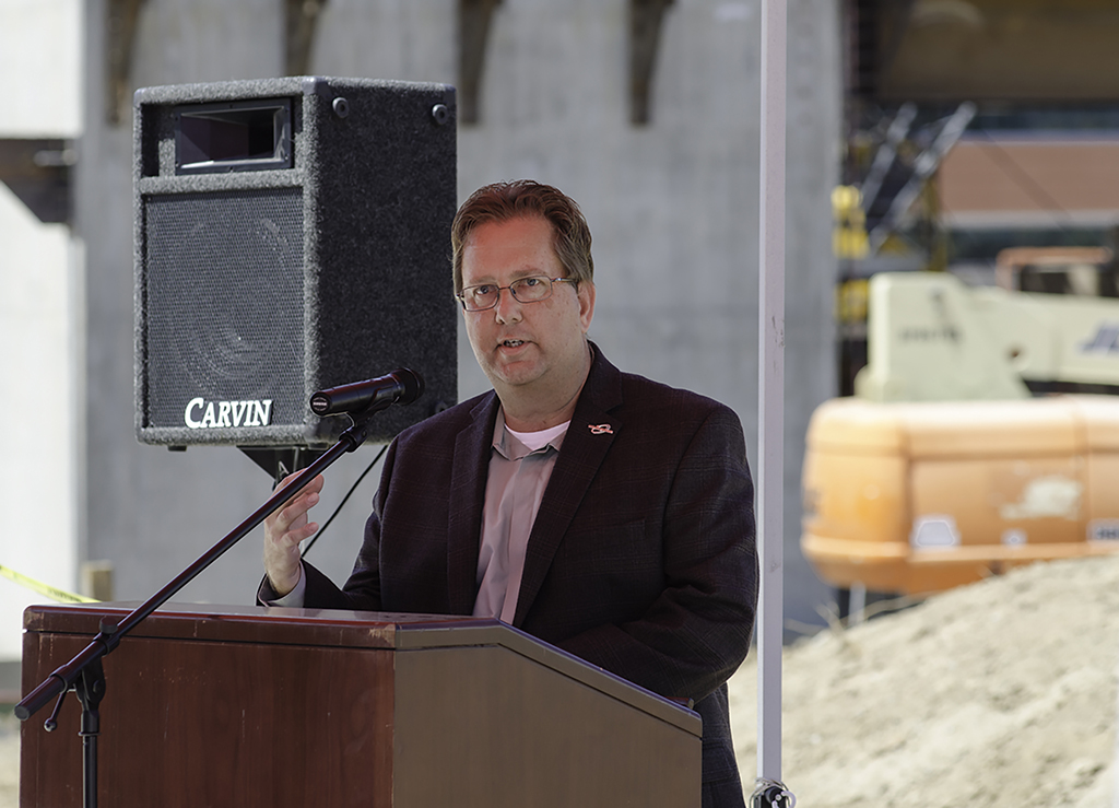 Dennis Astl Manager of Construction and Facilities Planning at Palomar College gives a speech during the Topping Out Ceremony held at the San Marcos campus on July 28. The Ceremony was commemorating the construction of Palomar's new Library/Learning Resource Center by hoisiting up the last beam and bolting it into place. The new expected completion date is June of 2018. Tracy Grassel/The Telescope