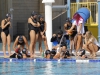 Palomar coach Jackie Puchino (black jacket) talks strategy with her players during a timeout at the Women's Water Polo PCAC Conference game between Palomar and Grossmont on Nov. 4 at the Ned Baumer Pool. Palomar women won 9-5. Coleen Burnham/The Telescope