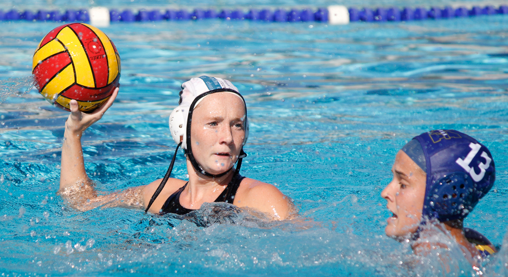 Palomar's Sydnee Thomas (4) shoots goal 6 for the Comets during the 2016 Women's Water Polo PCAC Conference against Mesa on Nov. 5 at the Ned Baumer Pool. Mesa's Andreanna Mill (13) offers defence. Thomas tallied 1 goal for the game and Palomar won the title with a score of 8-7. Coleen Burnham/The Telescope