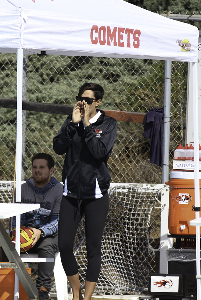 Palomar's Head Coach Jackie Puccino giving pointers to her team during the game against Miramar. Palomar won 9-4 against Miramar on Oct. 12 at the Wallace Memorial Pool. Kayla Rambo/The Telescope