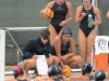 Palomar Head Coach Jackie Puccino dicusses strategic moves with her players during a time-out on Sept. 26. Palomar played Southwestern College at Wallace Memorial Pool and defeated them 19-1. Tracy Grassel/The Telescope