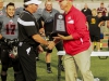 November 22, 2014 | Palomar Athletic Director Scott Cathcart presents Palomar Head Football Coach Joe Early with the Patriotic bowl trophy. The Comets defeated the Vaqueros 30-22 and win the Patriotic Bowl at Escondido HS, in Escondido California. Photo: Philip Farry | The Telescope
