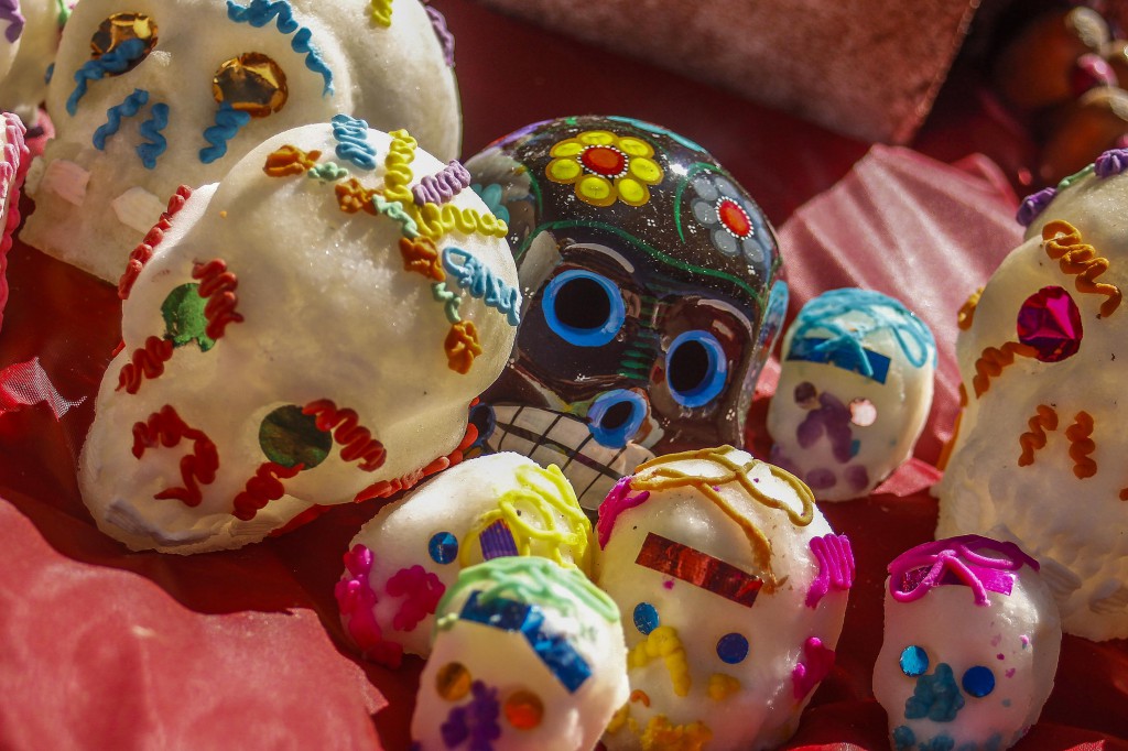 Day of the Dead altars are often decorated with sugar skulls and small mementos of the deceased. Photo: Angela Marie Samora | The Telescope