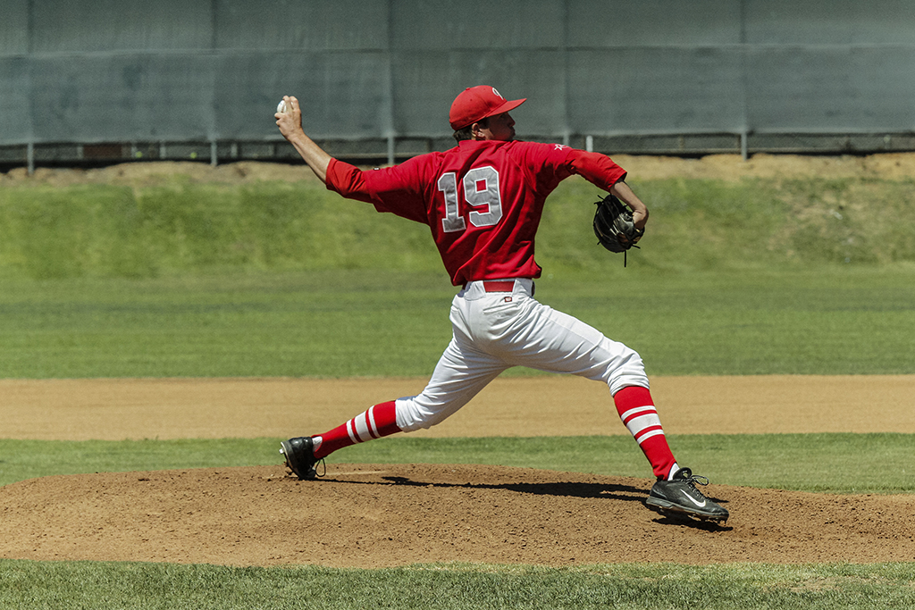 Palomar's Jake Barnett delivers a pitch during the first inning against visiting Grossmont College. Barnett threw a complete game striking out 11 and allowing only 6 hits and improved his record to 7-1. The Comets beat the The Griffins 4-2 at Myers Field Friday 17 April and improved their record to 28-5 (19-2 in PCAC) and are ranked #1 in Southern California. Philip Farry / The Telescope