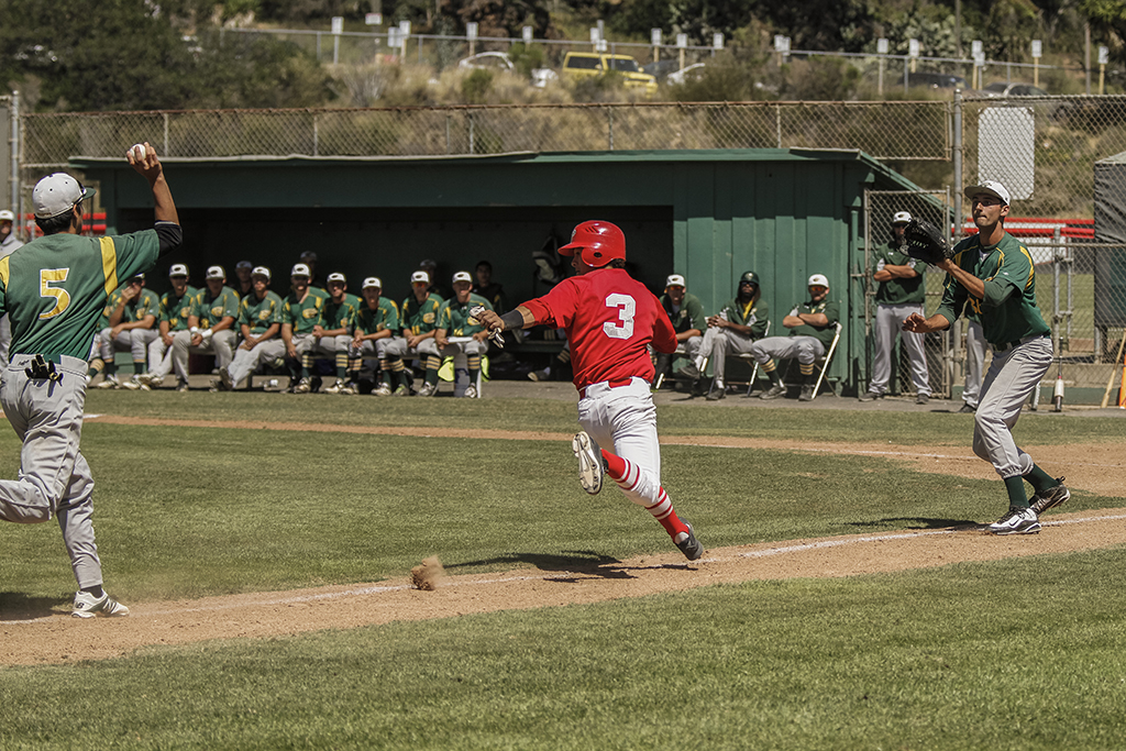 Palomar's Chris Stratton gets in a rundown between third base and home during the second inning against Grossmont College. Stratton eventually was tagged for the second out of the inning. The Comets beat the The Griffins 4-2 at Myers Field Friday 17 April and improved their record to 28-5 (19-2 in PCAC) and are ranked #1 in Southern California. Philip Farry / The Telescope