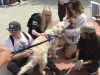 Trevor the Golden Retriever and surfing pro with Love on a Leash giving major kisses on campus. May 14, 2018. Emily Whetstone/ The Telescope.