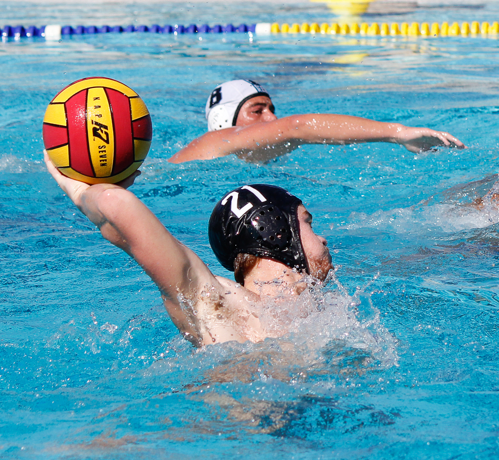 Palomar's Dylan Van Horn (21) scores goal 15 for the Comets during the Men's Water Polo PCAC Conference game between Palomar and Miramar on Nov. 4 at the Ned Baumer Pool. Jeff Burr (8) swims along in back. Palomar men won 22-12. Coleen Burnham/The Telescope