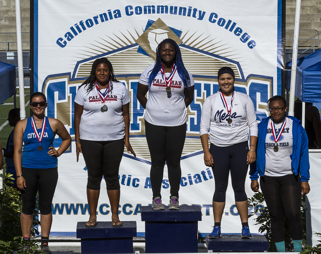 Palomar’s De’ondra Young (center) and Simone Everett (second from left) finished first and second in the hammer throw and shot put. Everett took first place in the discus and Young finished second during the Pacific Coast Athletic Conference Track and Field Championship held at Mesa College Apri 18. Philip Farry / The Telescope.