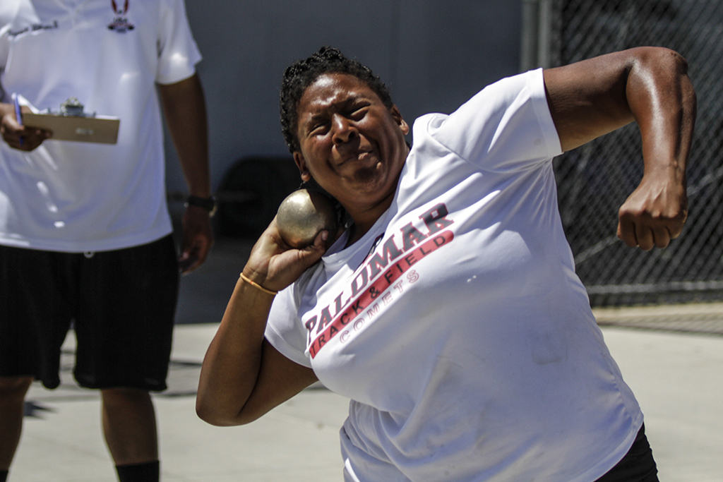 Palomar’s Simone Everett launches the shot put during the Pacific Coast Athletic Conference Track and Field Championship held at Mesa College April 18. Everett took second place in both the shot put and Hammer throw and won the discus event. Philip Farry / The Telescope.