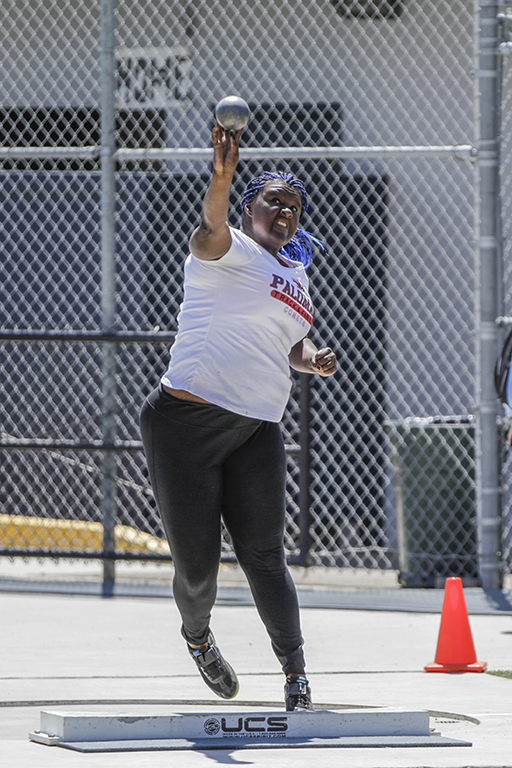 Palomar’s De’ondra Young launches the shot put during the Pacific Coast Athletic Conference Track and Field Championship held at Mesa College April 18. Young won the event with a throw of 37feet. Philip Farry / The Telescope.