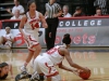 Palomar guard Regina Sheffield (on floor) grabs the loose ball as Roshell Lamug (14) awaits the pass during the first half of the Feb. 26 CCCAA Soouthern Regional Playoffs 2nd round game at The Dome. Sheffield had 12 points, 10 rebounds, and 4 steals in the game; The Comets won 77-54. Stephen Davis/The Telescope