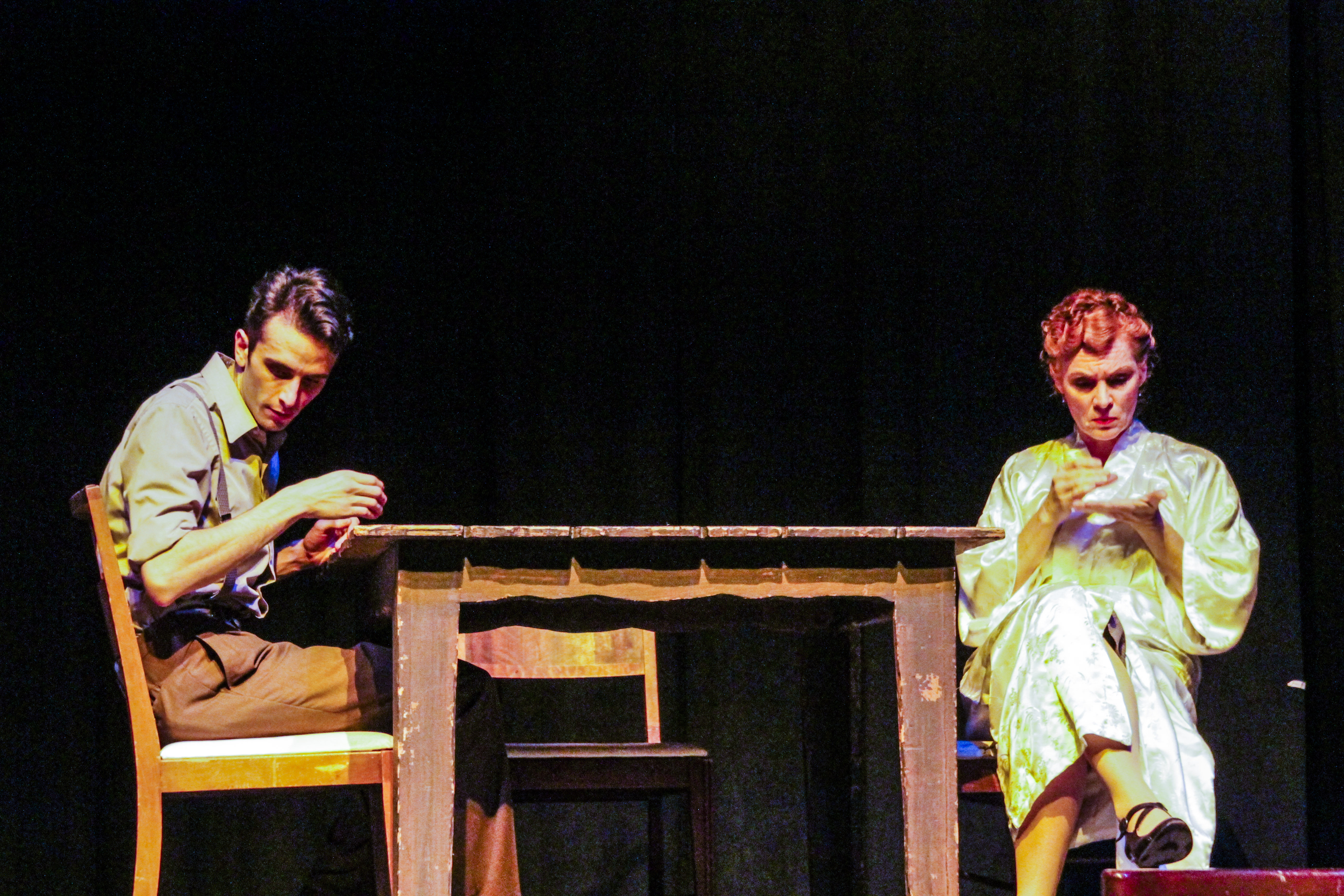 Tom (right, performed by Sean LaRocca) and his mother Amanda (right, performed by Heidi Bridges) sit at the same table although worlds apart in The Glass Menagerie playing at Palomar College. Lucas Spenser/Telescope.