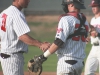 Relief pitcher Michael Jordan (#31) shakes hands with catcher Bubba Craig (#28) after recording the final out in the 9th inning against College of the Desert on Feb. 20 at Myers Field. The Comets got shutout pitching performances from Emilio Esquibel, Josh Bravin, Kamden Haglund, and Michael Jordan in their 5-0 win over the Road Runners. Scott Colson/The Telescope