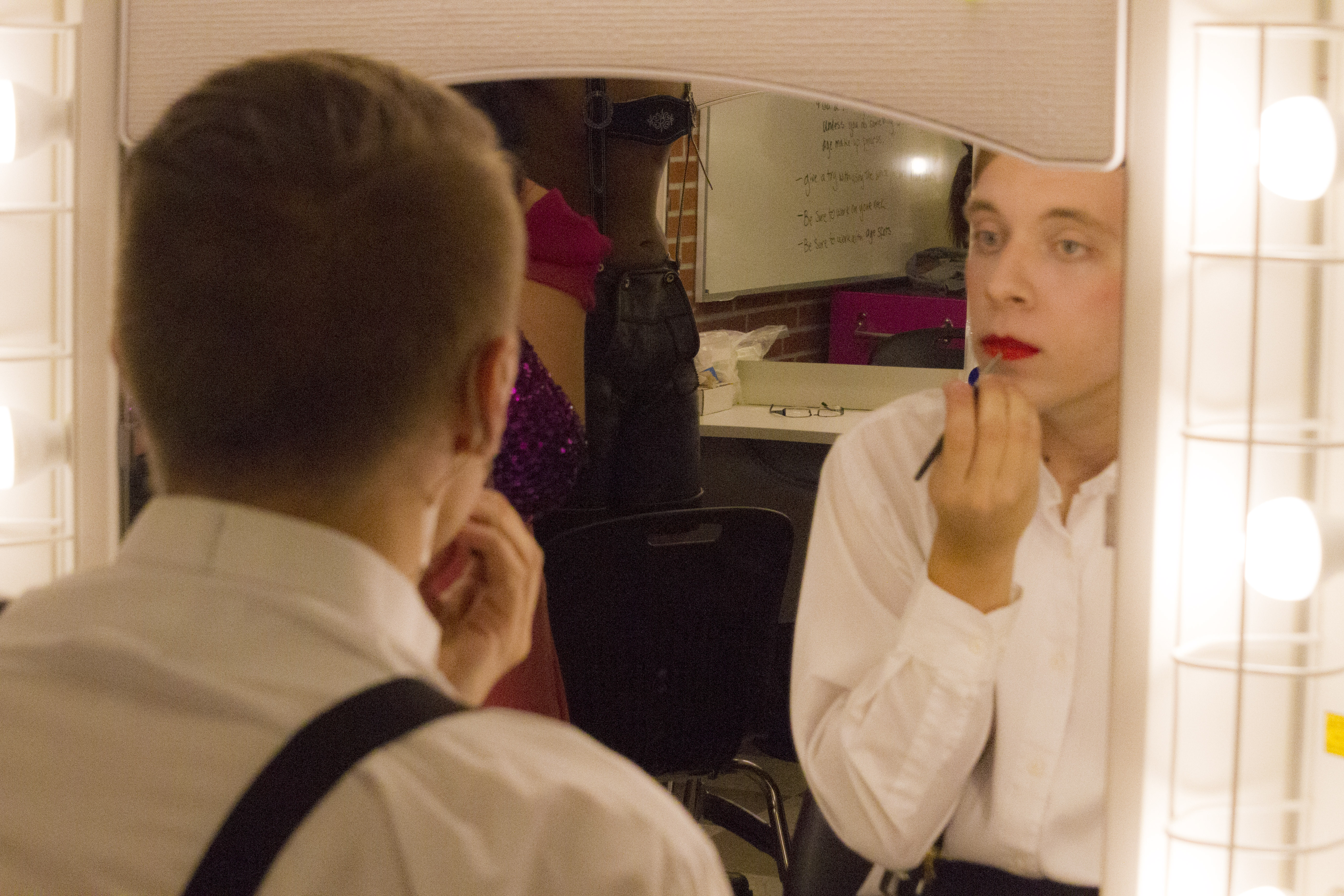 Caleb Halsted playing the Emcee in the production of Cabaret dons his stage make-up before dress rehearsal. Lucas Spenser/telescope 2014.