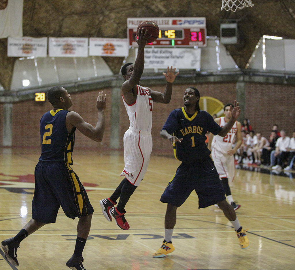 Dec. 1, 2013 | Palomar’s Josiah Dennis (5) scores on a layup during the third-place game of the 9th Annual Palomar Thanksgiving Tournament at The Dome. (Stephen Davis/The Telescope)