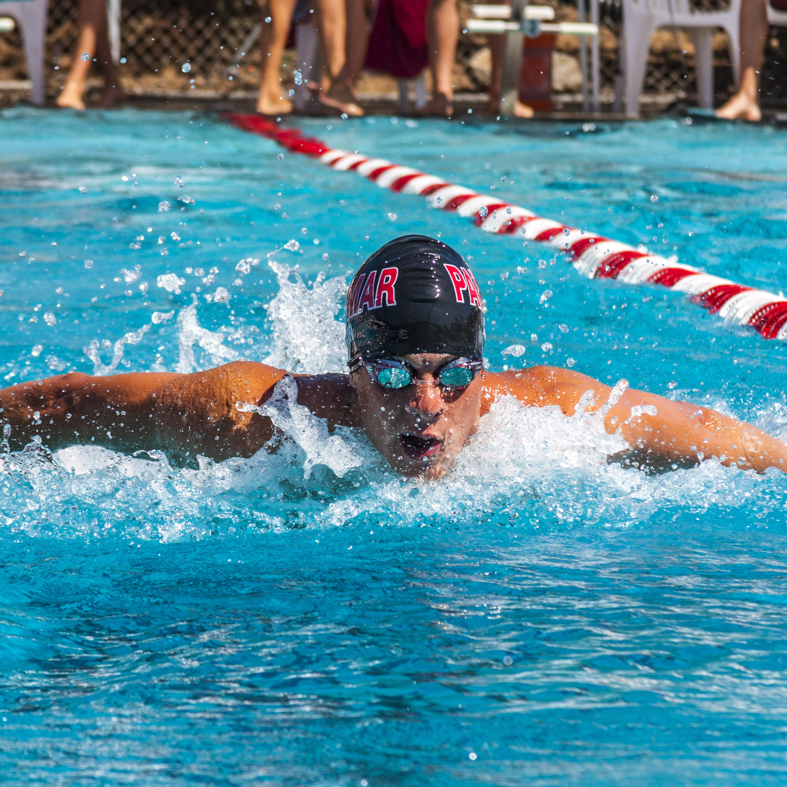 Joe Cain of Palomar College's men's relay team swims the butterfly during the men's 200-yard medley against Grossmont on March 14, 2014 at the Wallace Memorial Pool. (Lucas Spenser/Telescope)