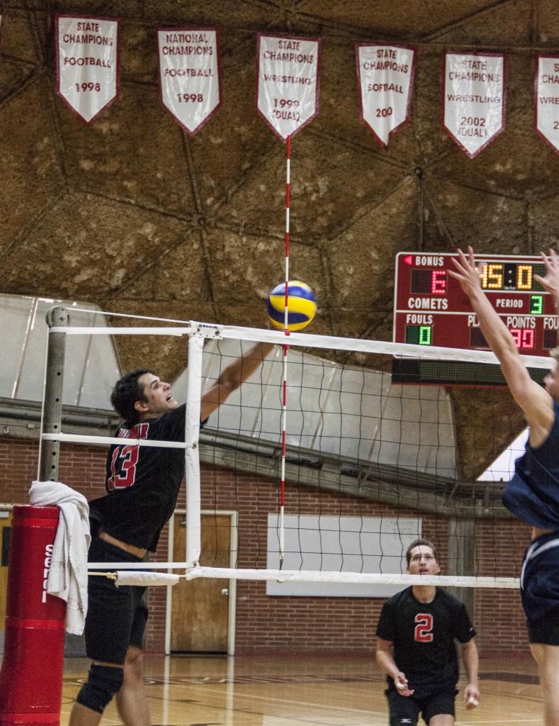 Palomar College Sophomore Middle-Blocker Anthony Pippen (left) scores by faking a spike against Orange Coast College, Wednesday April 2, 2014 in the Dome. Lucas Spenser/Telescope.