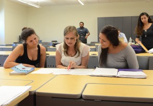 Michelle Vogel-Trautt Psychology Faculty Instructor Award discusses class assignment with student Jessica Holden (right) and Chloe Dolkan (left) before class on April 24, 2014 at Palomar College San Marcos Campus. Lucy Wheeler_Telescope