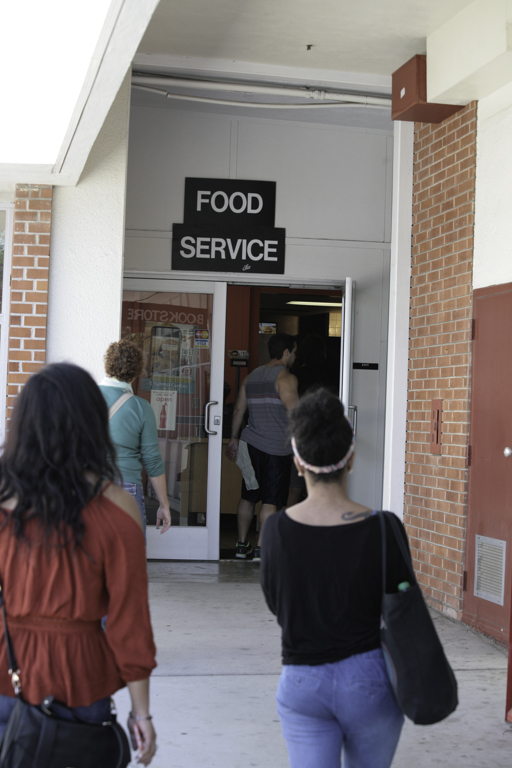 Students file through the cafeteria entrance doors at Palomar College San Marcos Campus Oct. 8, 2014. (Erika Shasky/The Telescope)