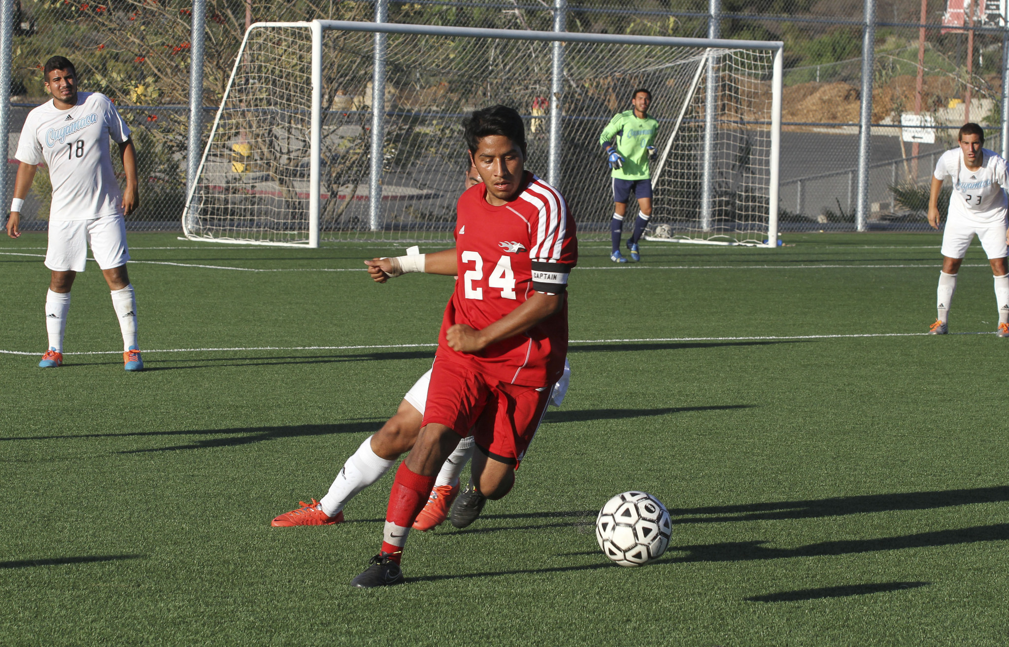 Palomar's midfielder Miguel Pineda (No.24) dribbles past a defender during a game against Cuyamaca on October 24th at Minkoff Field San Marcos, California. Comet's 2-0 loss to Cuyamaca. 
