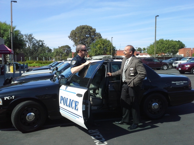 Palomar Police Chief Mark DiMaggio checking in with Officer Stephen Wilson in front of the college's Police Department on Oct. 14, 2014. (Emily Rodriguez/The Telescope)