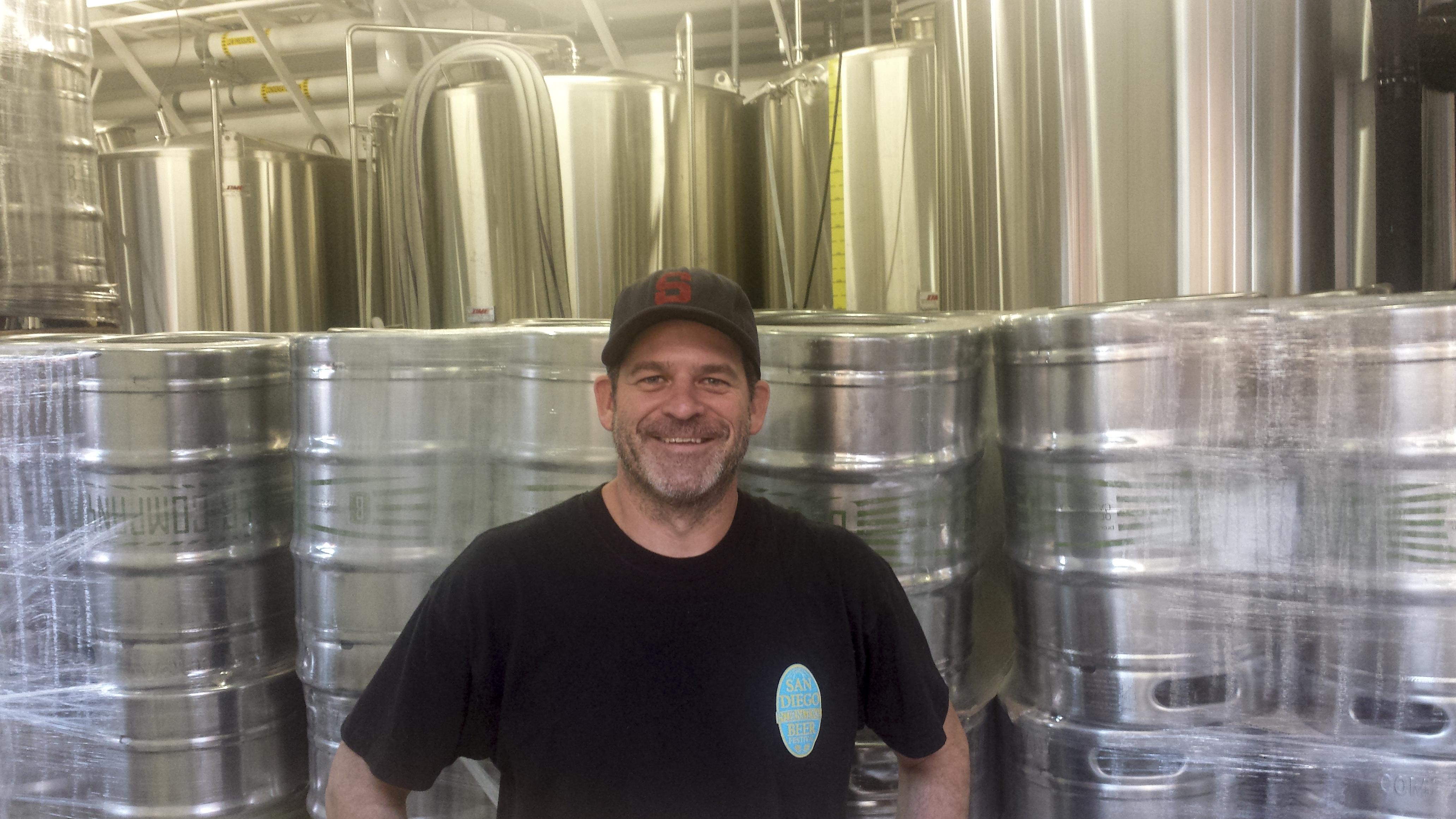 Jeff Bagby owner of Bagby Beer Company on Oct. 11, 2014 in front of new kegs in the brewery located in Oceanside, Calif. (Photo courtesy of Deb Hellman)