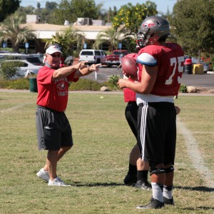 Quarterback Coach Bill Diedrick working with his players at the Palomar football field. Photo by Erika Shasky