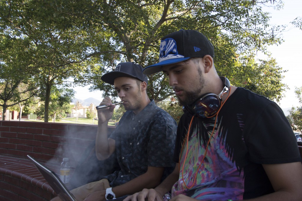 Palomar Students Cody King and Paul Rotaru smoking e-cigarettes while taking a break in between classes. October 14, 2014. Photo by Paul Nelson|The Telescope