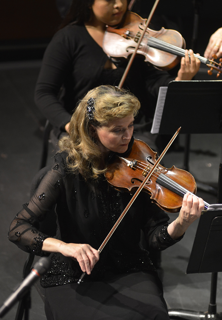 Concert Master, Ulli Reiner, plays her part with the Palomar Symphony Orchestra in the first concert of the water themed concert season on Oct. 10, 2014 in the Howard Brubeck Theatre. (Casey Cousins/The Telescope)