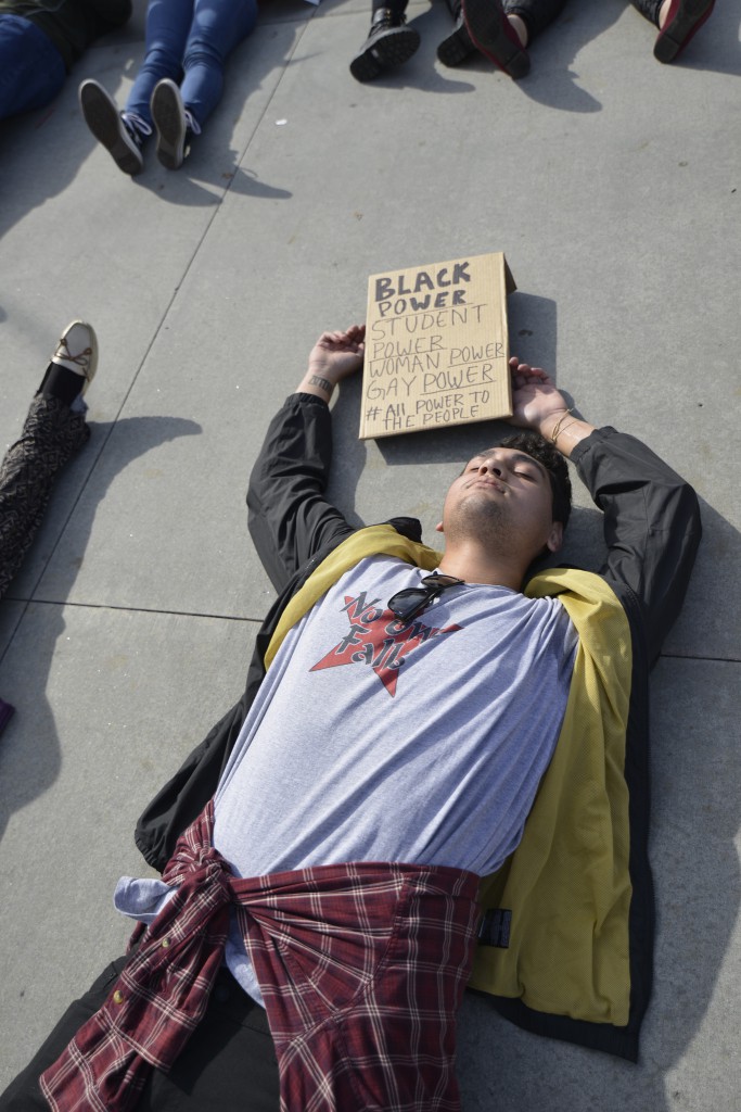 Jeremiah Tatola and others lie down in protest at the  Palomar College San Marcos campus on Dec. 10, 2014. Students and faculty members gathered to demonstrate what they feel is excessive force from police in recent events. Photo:  Casey Cousins | The Telescope