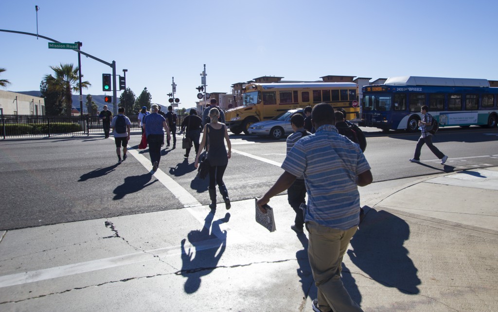 Palomar students make their way across Mission Road to the Sprinter station after class on Monday Nov 10, 2014. Telescope/ Gary West