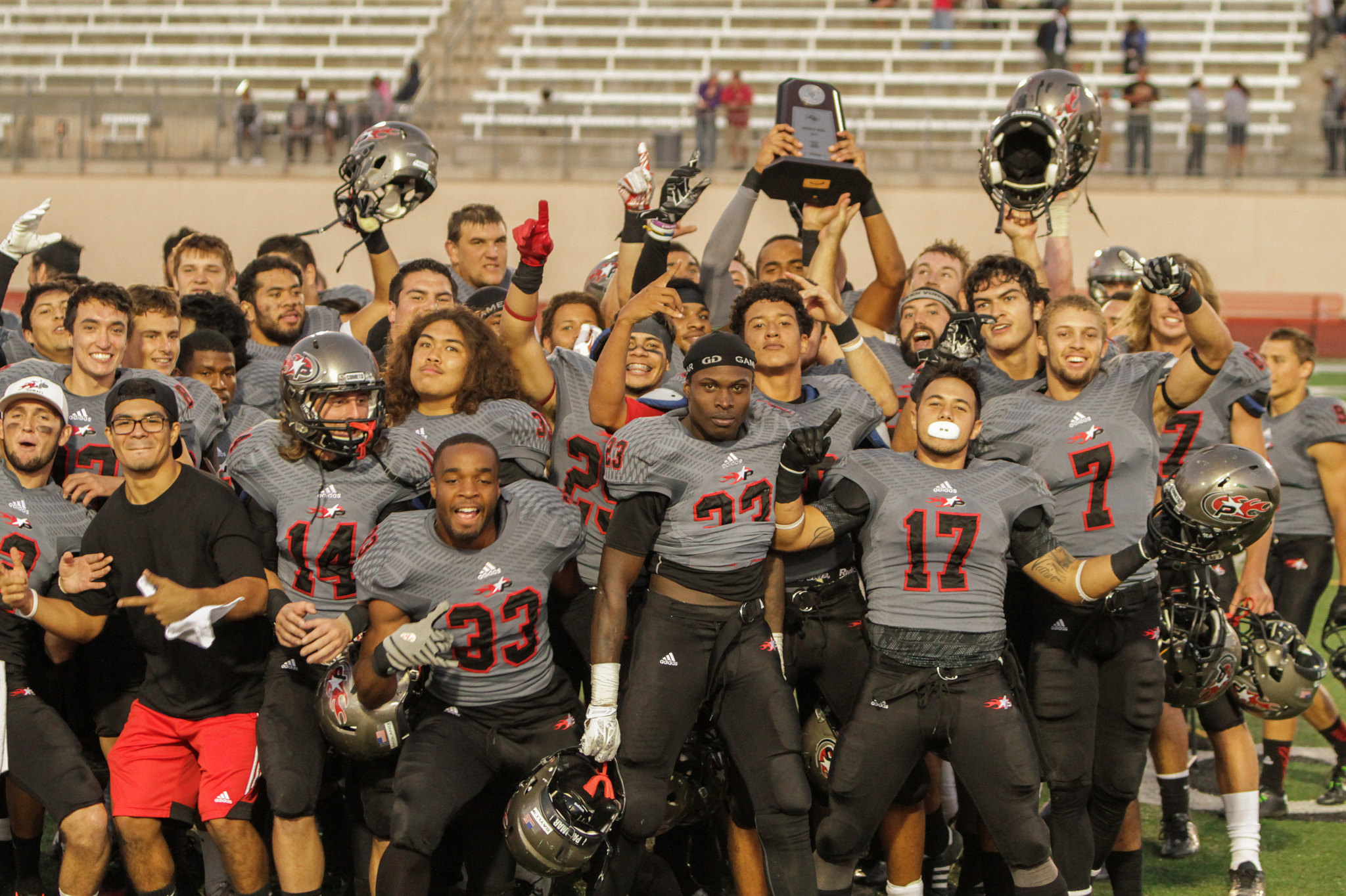 Nov. 22, 2014. Palomar football team celebrates after winning the Patriotic Bowl against Glendale College. The Comets defeated the Vaqueros 30-22 and finish the season 7-4 . The game was held at Escondido High School in Escondido, Calif. (Philip Farry/The Telescope)